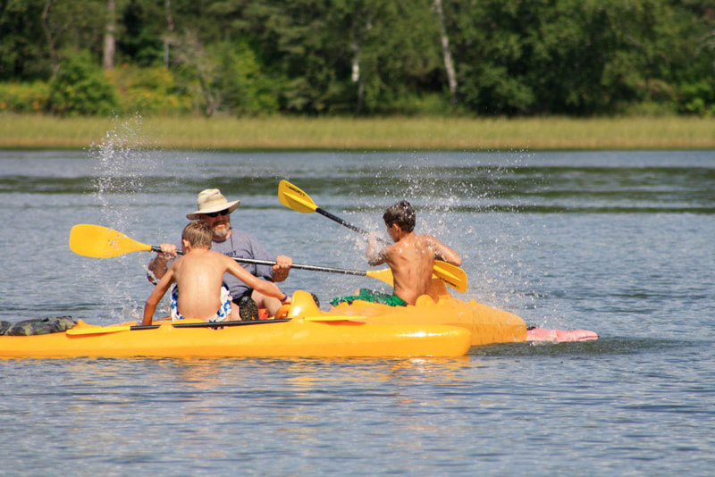family kayaks at Itasca State Park